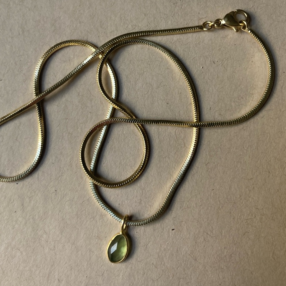 Gemstone necklace on gold chain